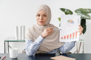 Concentrated mature muslim islamic businesswoman tutor lecturer conducting online
